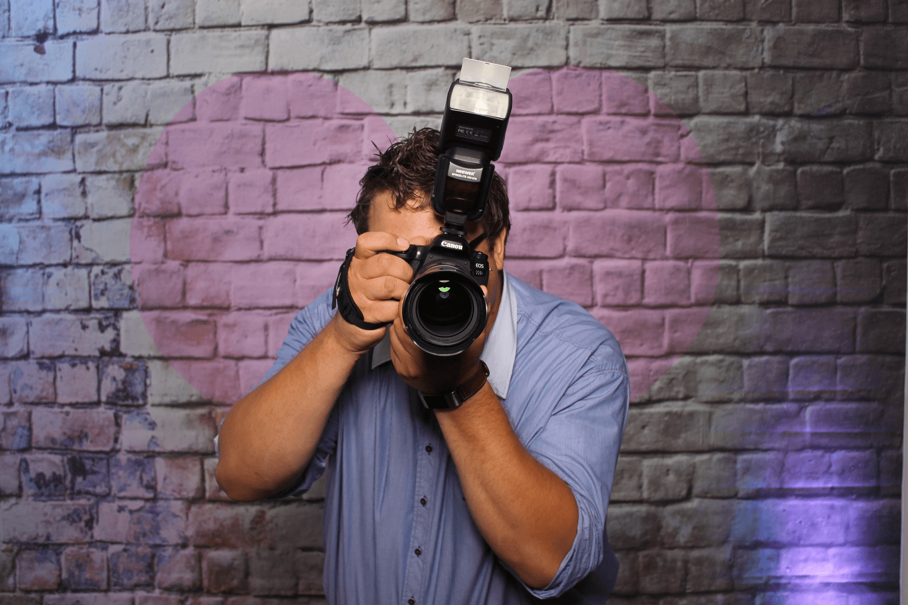 Fotograf mit professioneller Kamera - Börgi's Fotobox